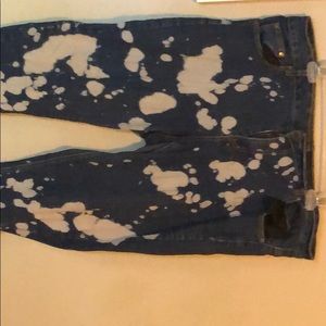 Very gently work acid wash jeans